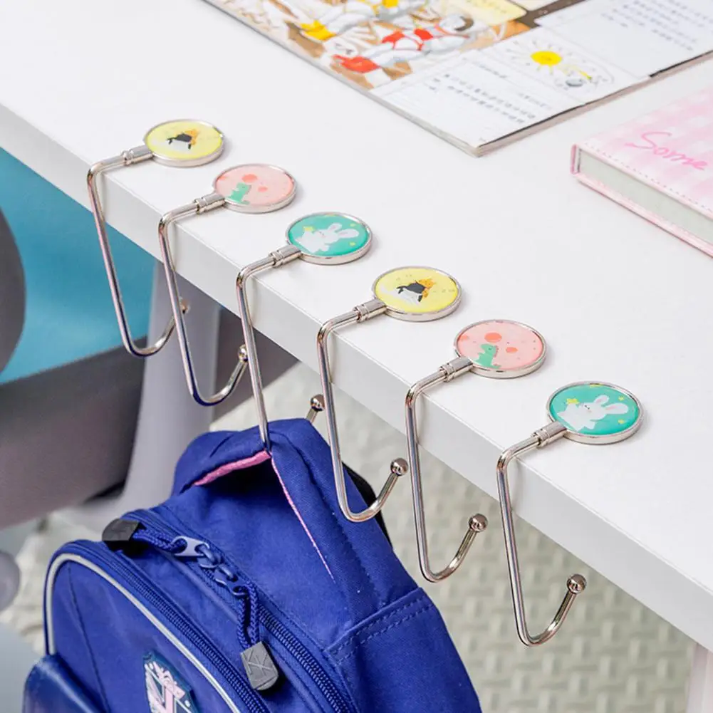 Gancho plegable de Metal portátil para bolso, colgador de mano, soporte de bolso, Concha, mesa plegable, 4 colores, nuevo - imagen 4