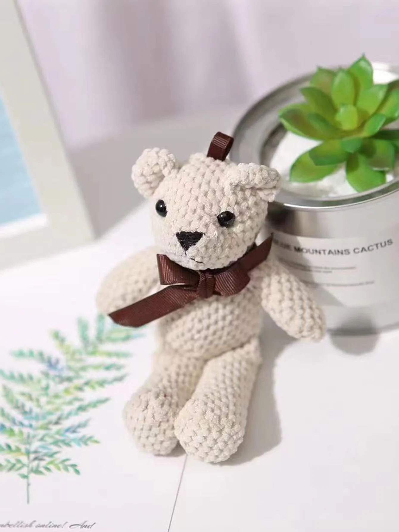 Osito de peluche con lazo – Juguete interactivo para perros y gatos - imagen 3