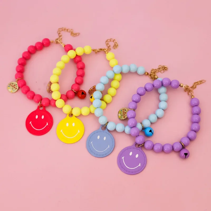 Gran oferta, Collar de perro con campana de color de la suerte, Collar de gato de perlas elástico hecho a mano con colgante de cara sonriente, accesorios para mascotas - imagen 2