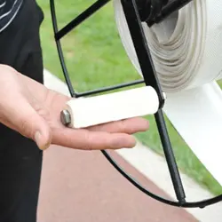Carrete enrollador de correas para perros con mango ergonómico