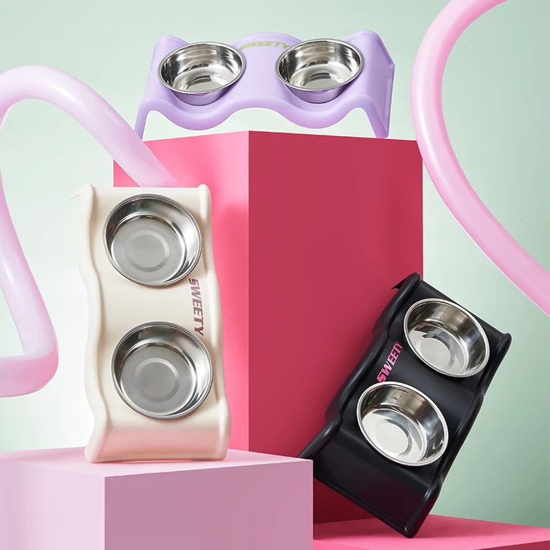 Un sonajero para mascotas, cuenco doble colorido de moda de gran capacidad de acero inoxidable para perros, cuenco doble anti-punta para alimentación de agua para mascotas para interiores
