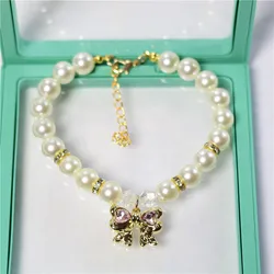 Collar ajustable con perlas imitación y lazo para perro o gato