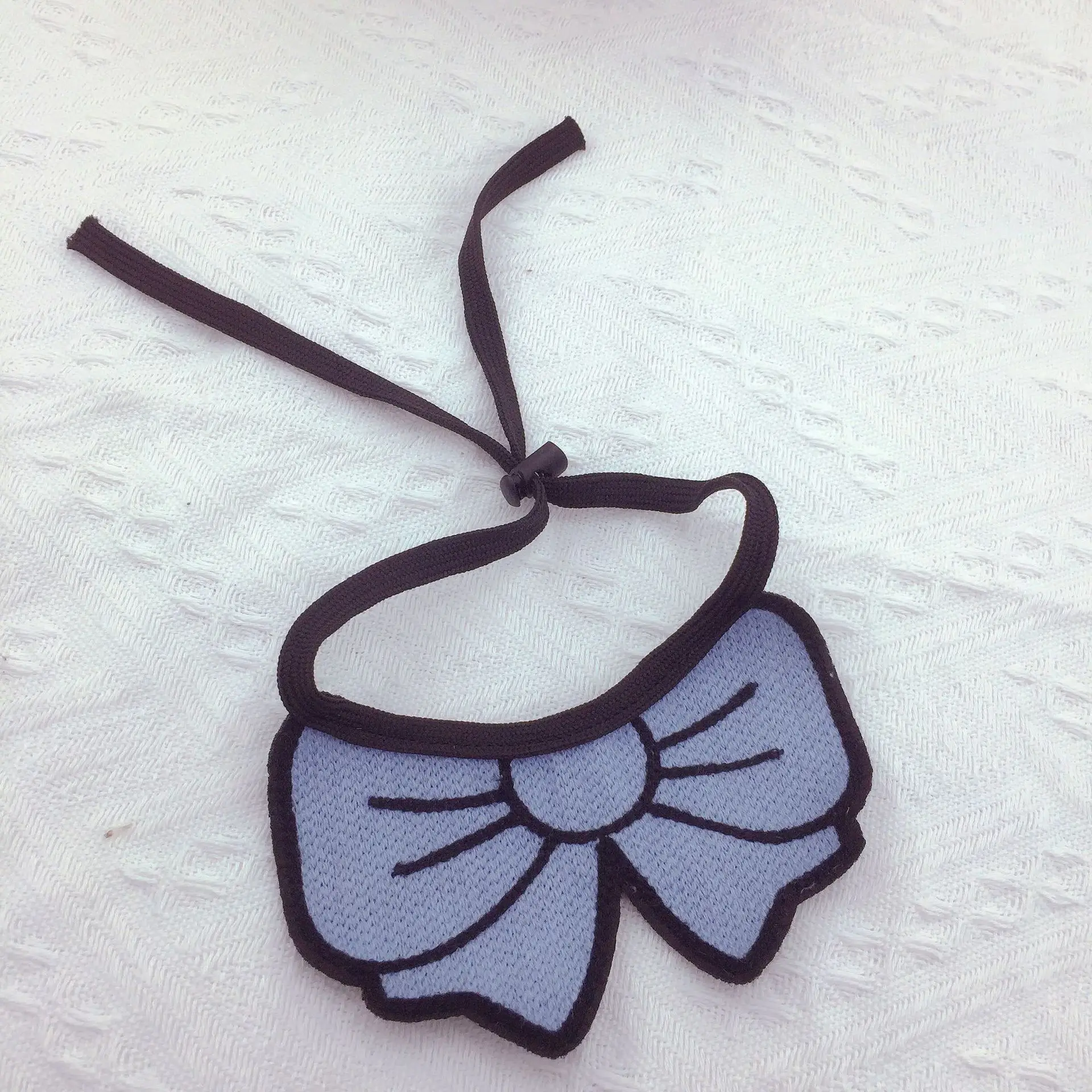 Conjunto con babero y accesorios