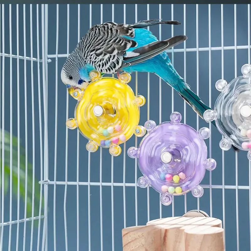 Juguete dispensador giratorio para loros: estimulación mental y diversión - imagen 3