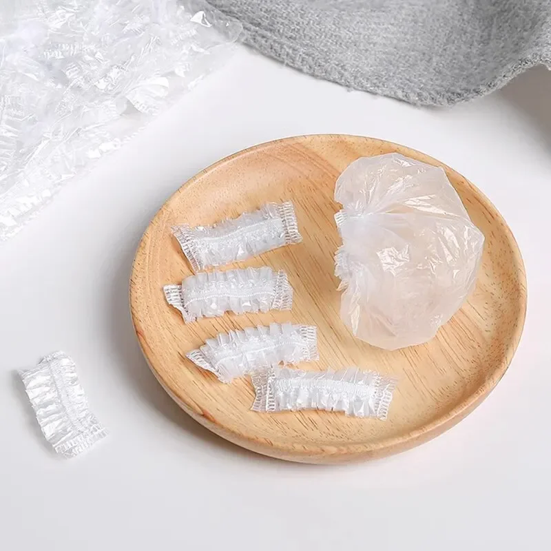 50-100 Uds. Orejera desechable para el cabello tinte transparente elástico ducha tinte para el cabello herramienta de protección escudo impermeable Earpack envoltura de plástico - imagen 5