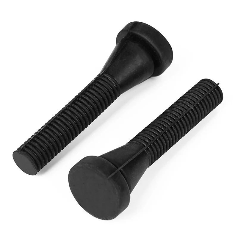 Dos tornillos de plástico negro con forma hexagonal