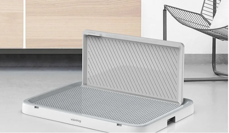 Inodoro para perros de interior con rejilla elevable