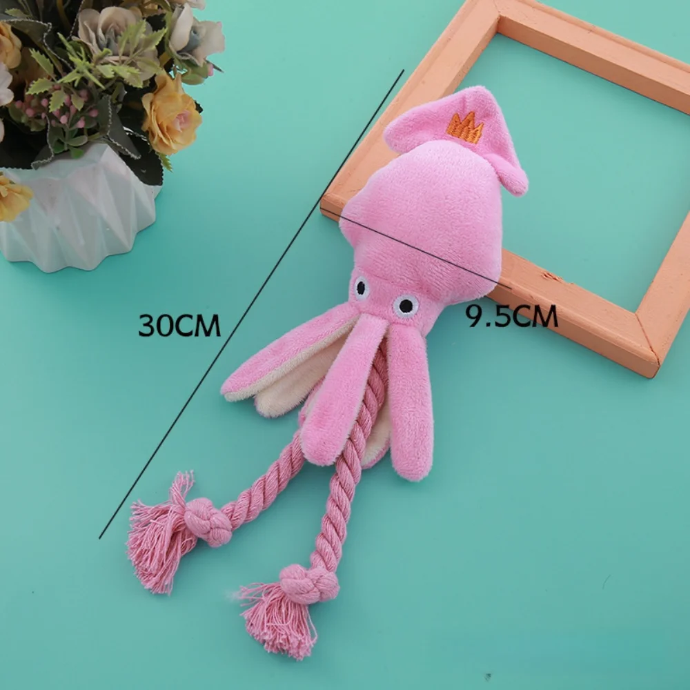 Juguete de cuerda de algodón con forma de pulpo rosa vista frontal