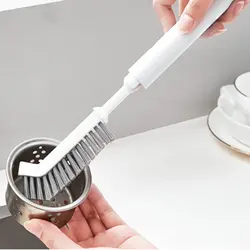 Cepillo limpiador de ranuras de fregadero con mango extensible