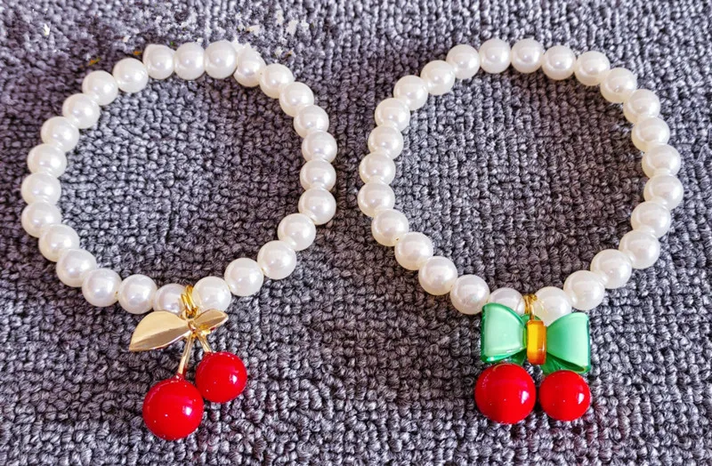 Collar de perlas para mascotas - detalle lazo