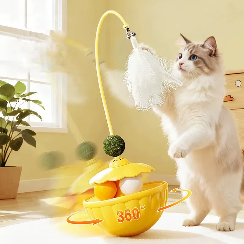 Juguete dispensador de golosinas con pluma giratoria y hierba gatera para gatos - imagen 2