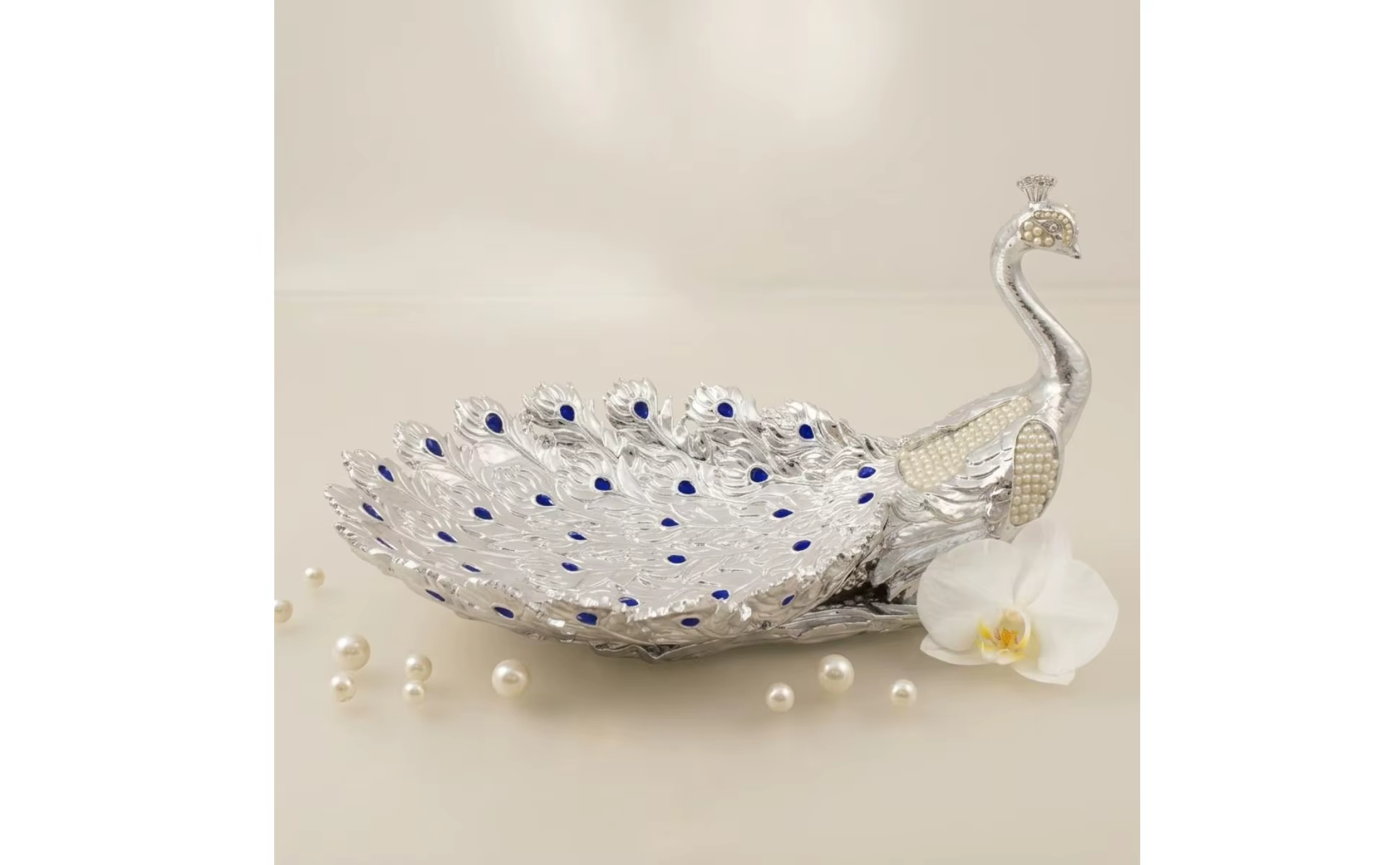 Frutero decorativo con diseño de pavo real y acabado dorado