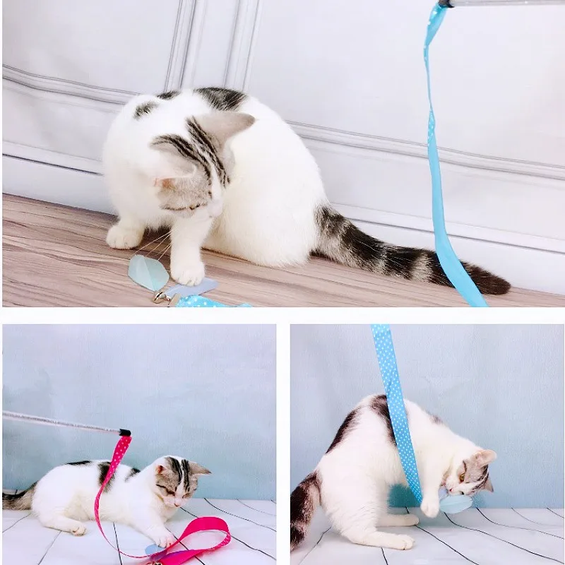 Mano moviendo el juguete mientras el gato salta