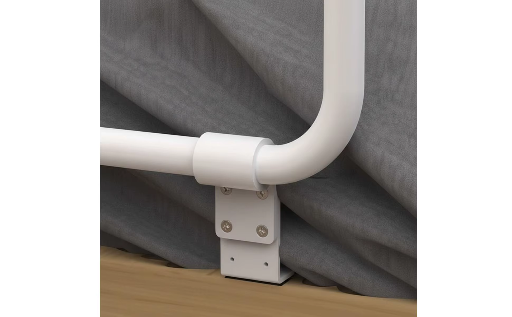 Barra de apoyo plegable instalada en la cabecera de la cama