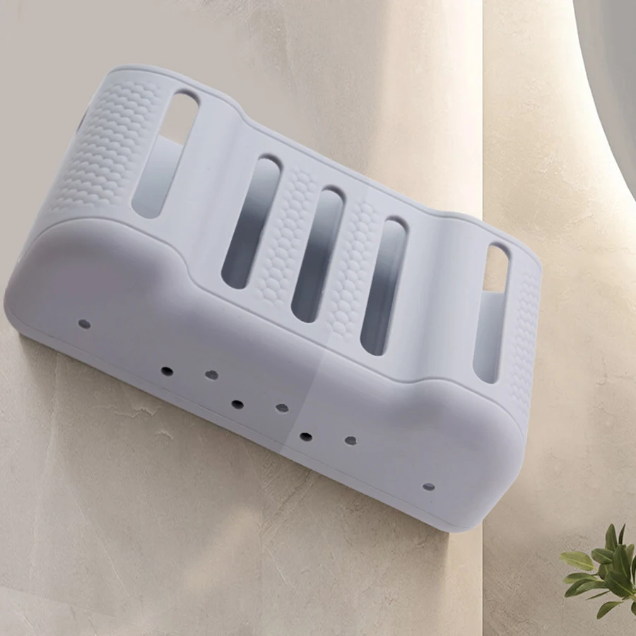 Soporte con cepillo eléctrico y afeitadora colocados