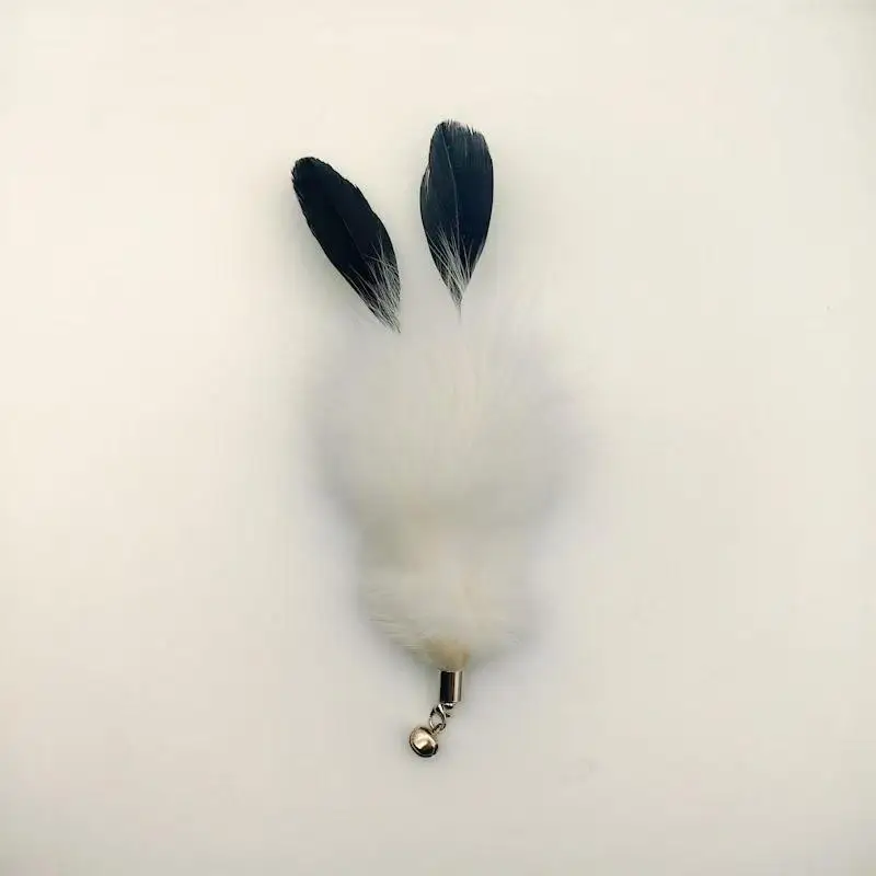 Varilla con plumas para gato