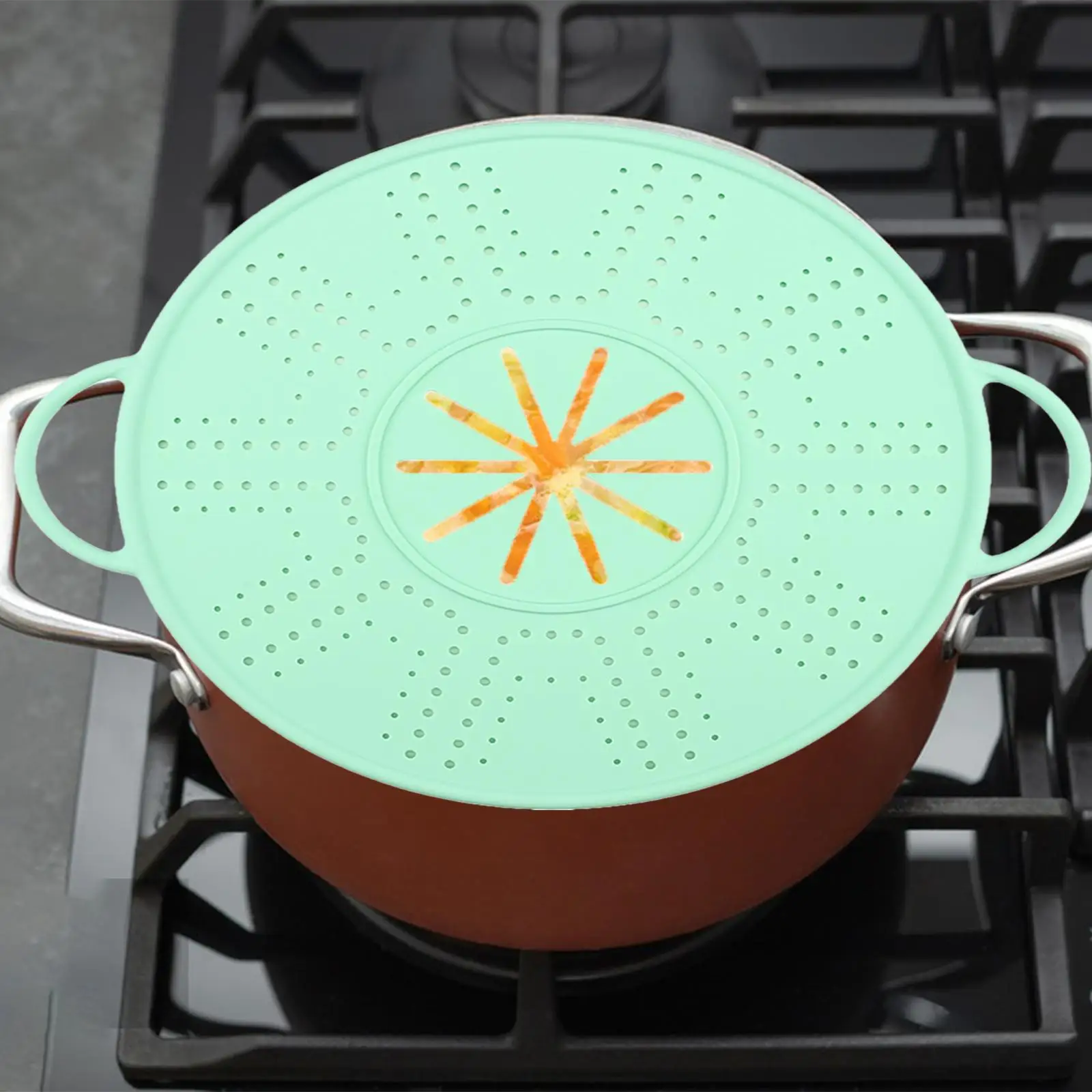 Tapa de silicona anti-derrames Kesoto verde sobre encimera de cocina