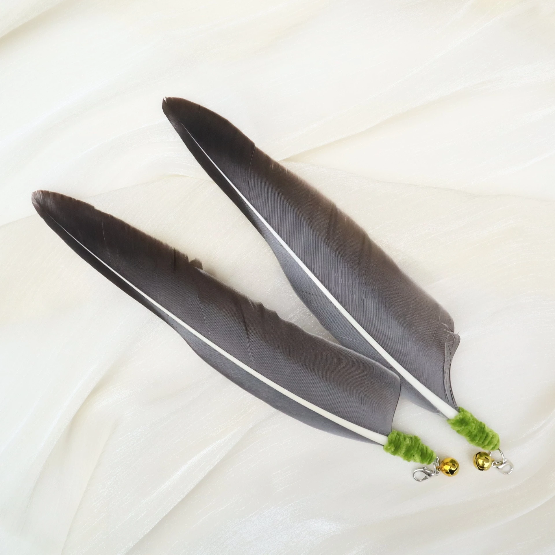 Acoplamiento de plumas a varita de gato