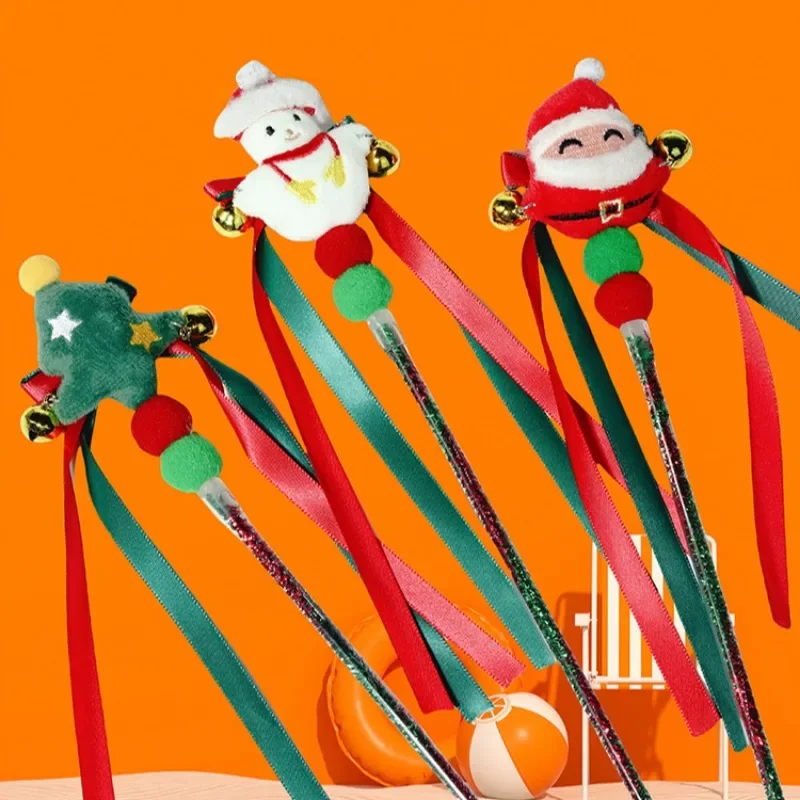 Varita interactiva con accesorio de campana en forma de Papá Noel