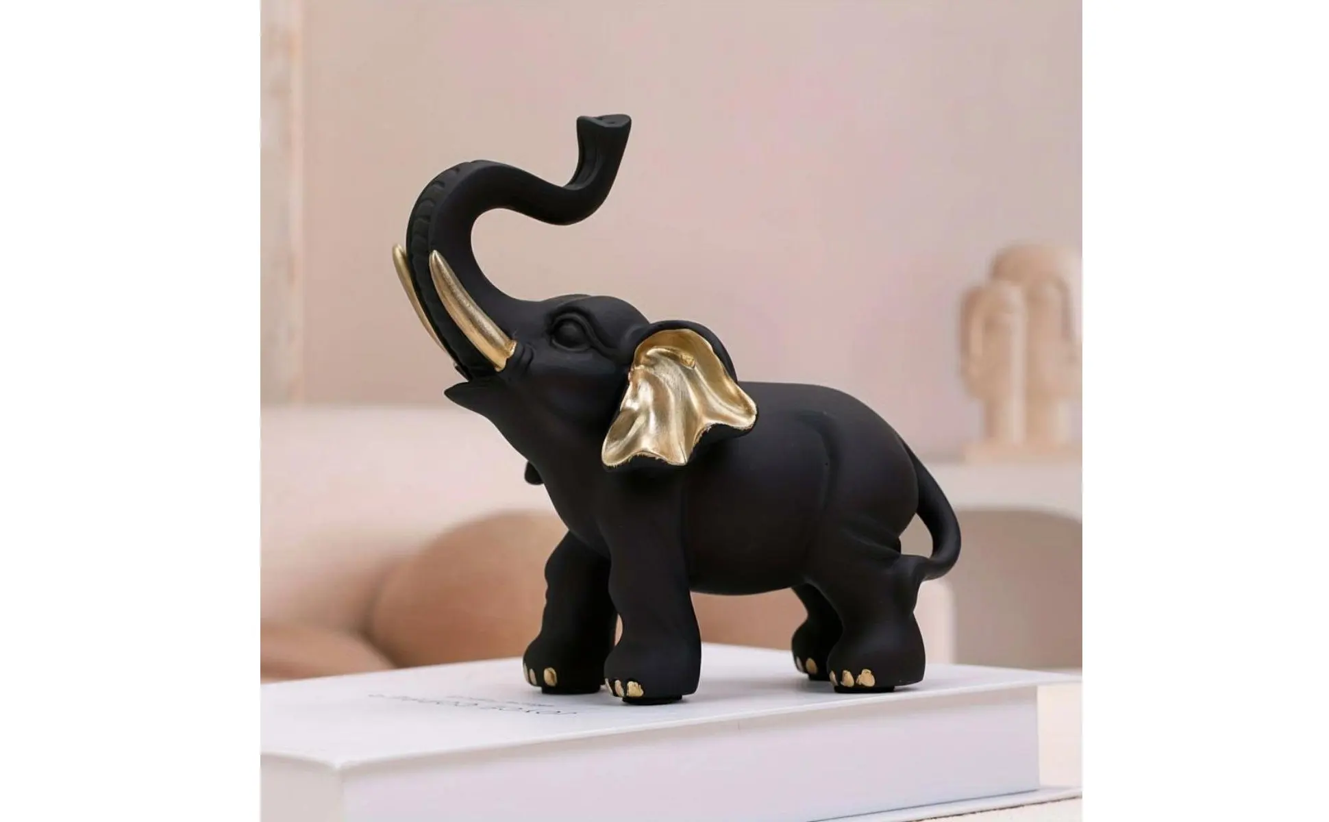 Figura de elefante negra y dorada de buena suerte