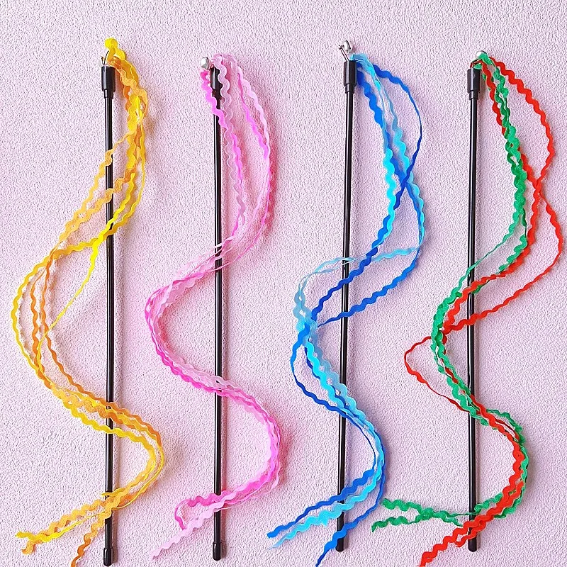 Vara de juego con borlas en uso