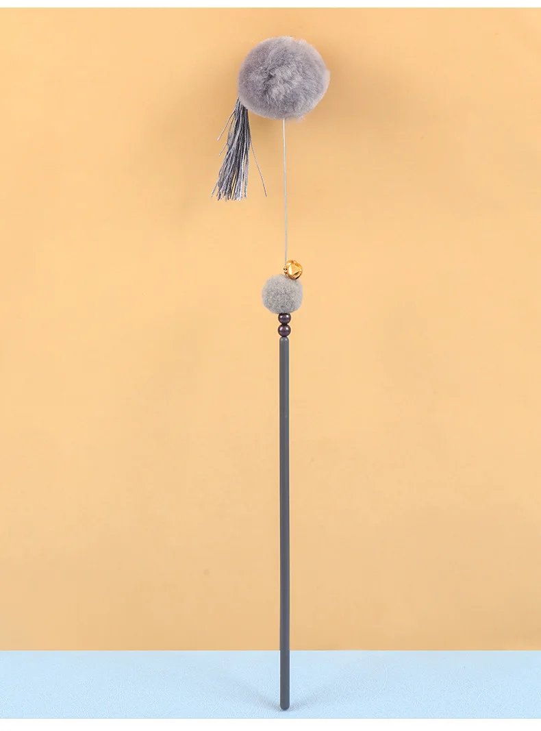 Uso del palo teaser con la borla de hada
