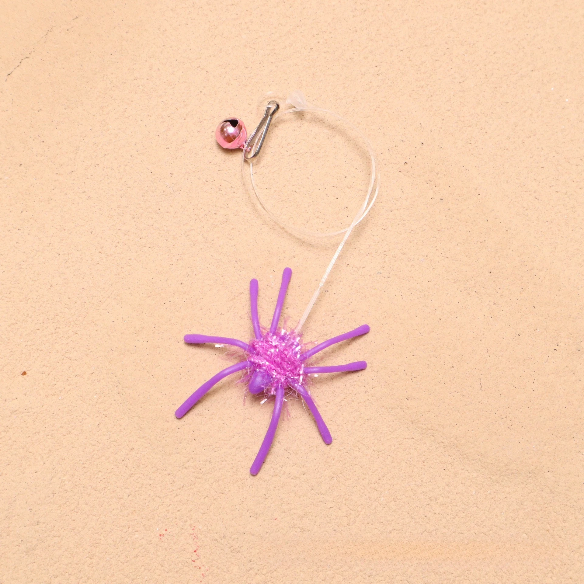 Accesorio tipo araña para estimular el juego