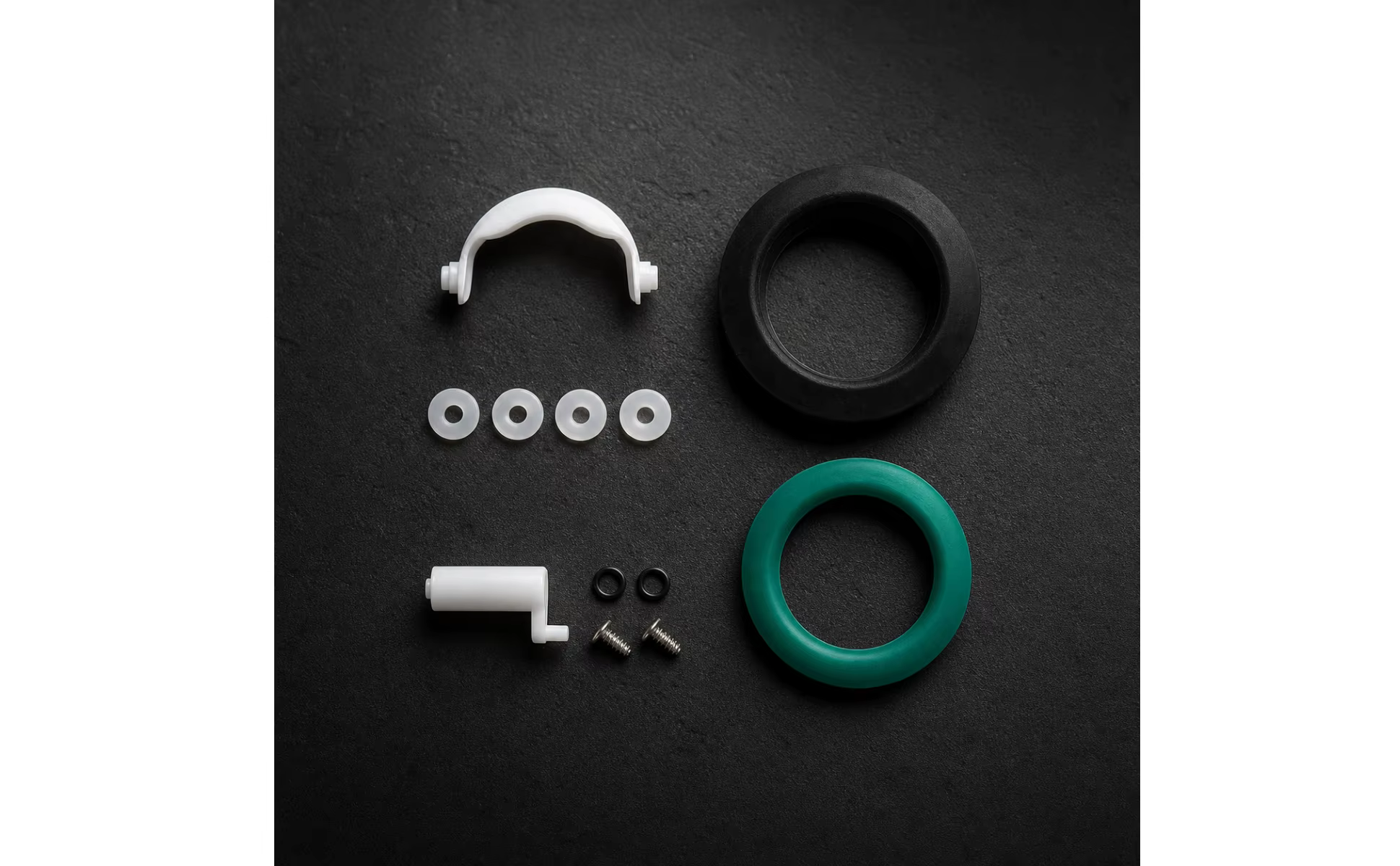 Detalle de los sellos circulares negro y verde del kit de reparación