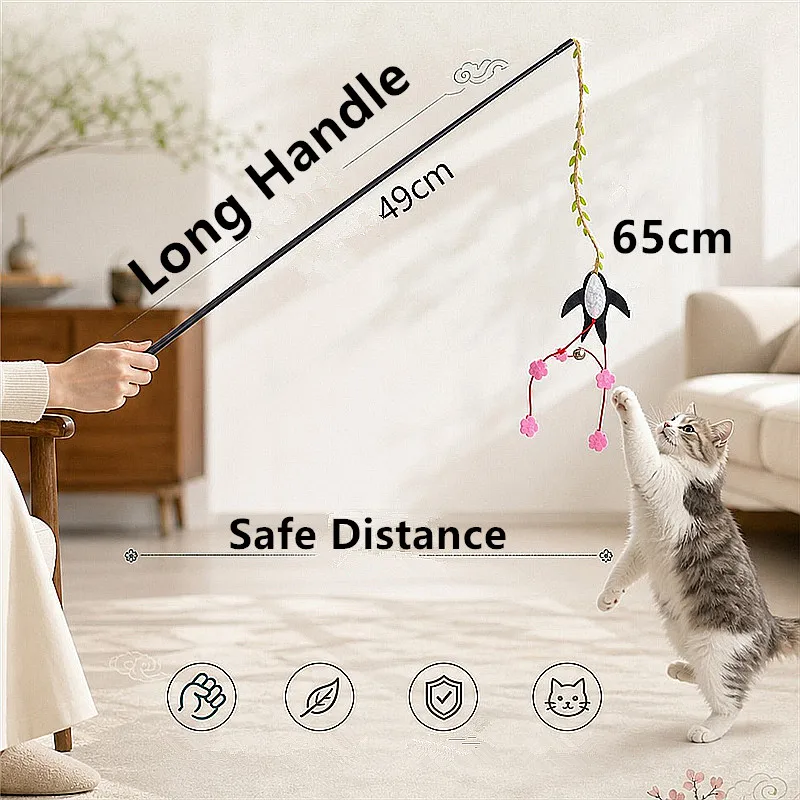 Gato jugando con varita y borlas