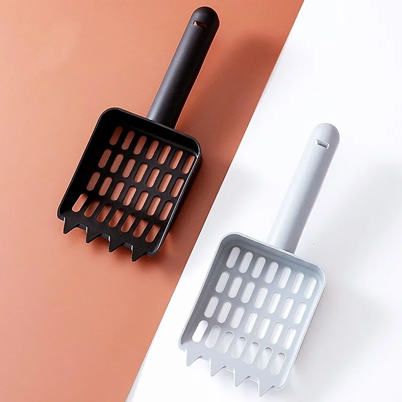 Pala de plástico para arena con mango ergonómico