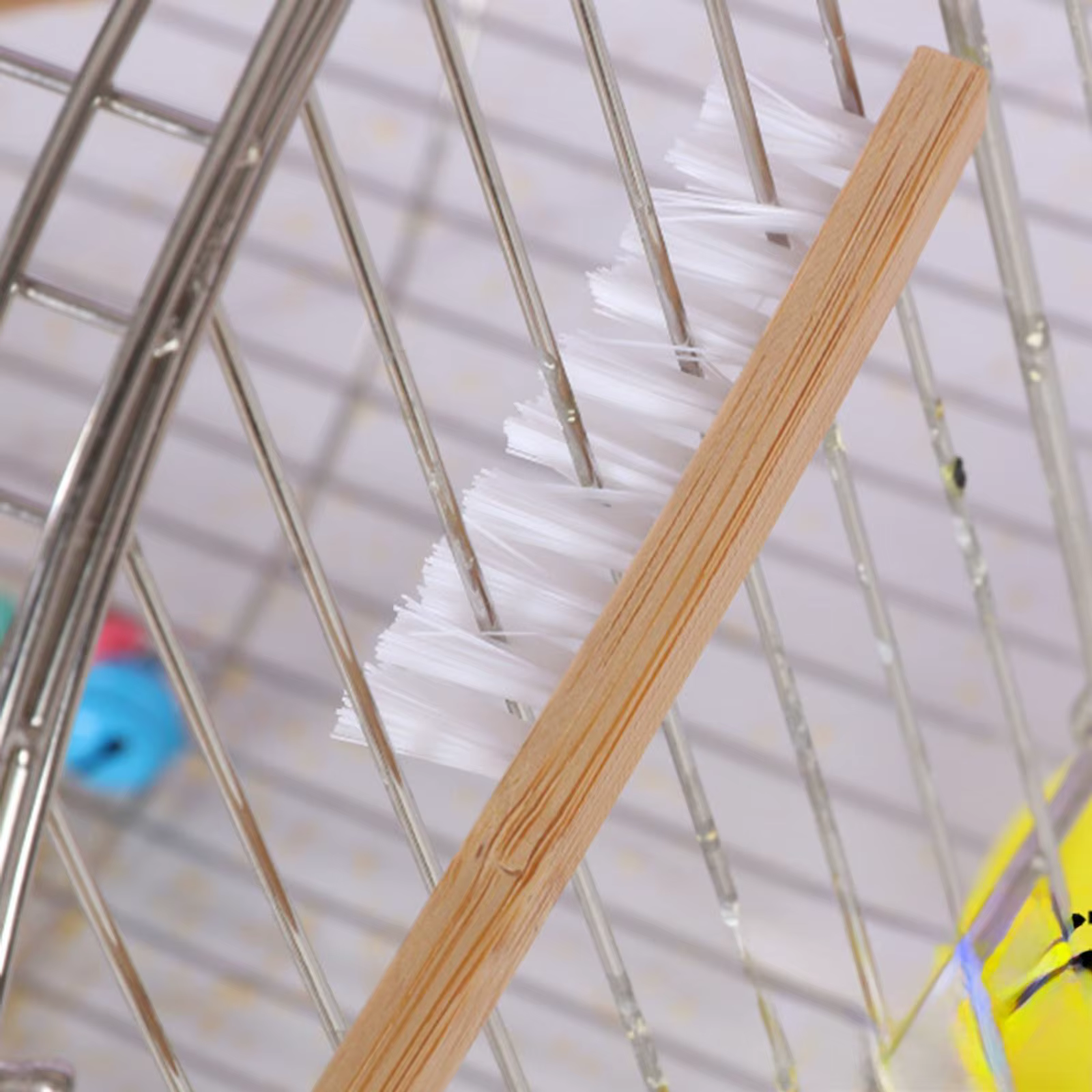 Cepillo extensible para limpieza de hábitats de aves
