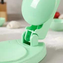 Prensa manual para dumplings y ravioles con mango ergonómico