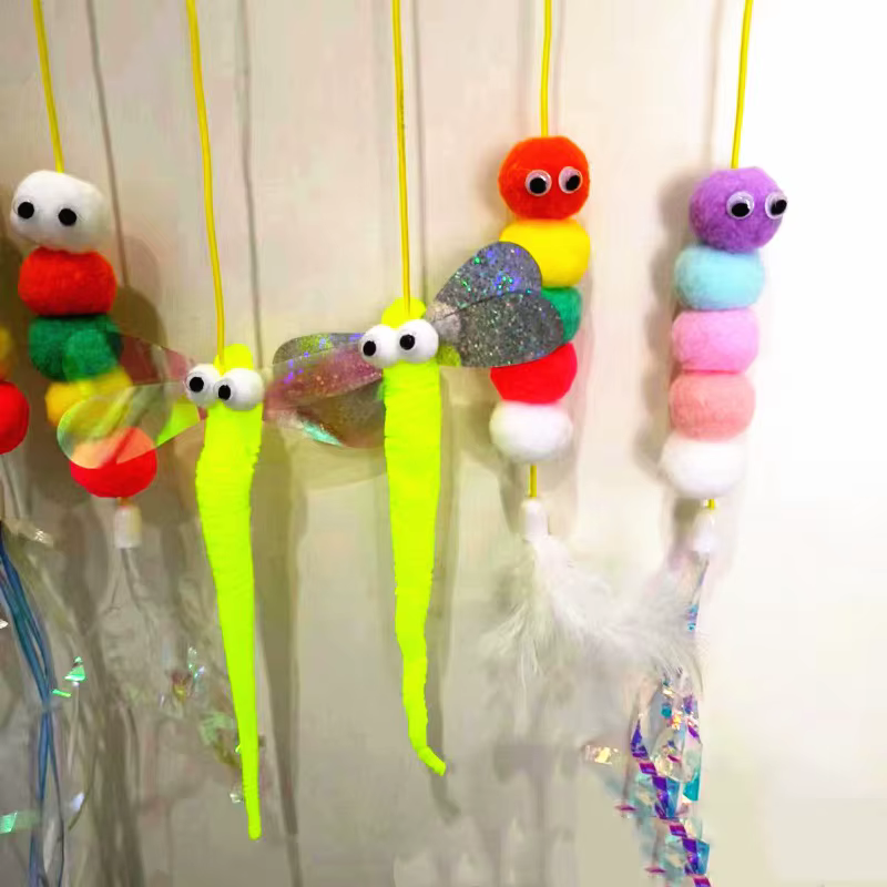 Juguete colgante con plumas para gatos y perros – cuerda elástica - imagen 5