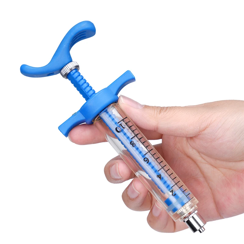 Jeringa veterinaria transparente con mediciones