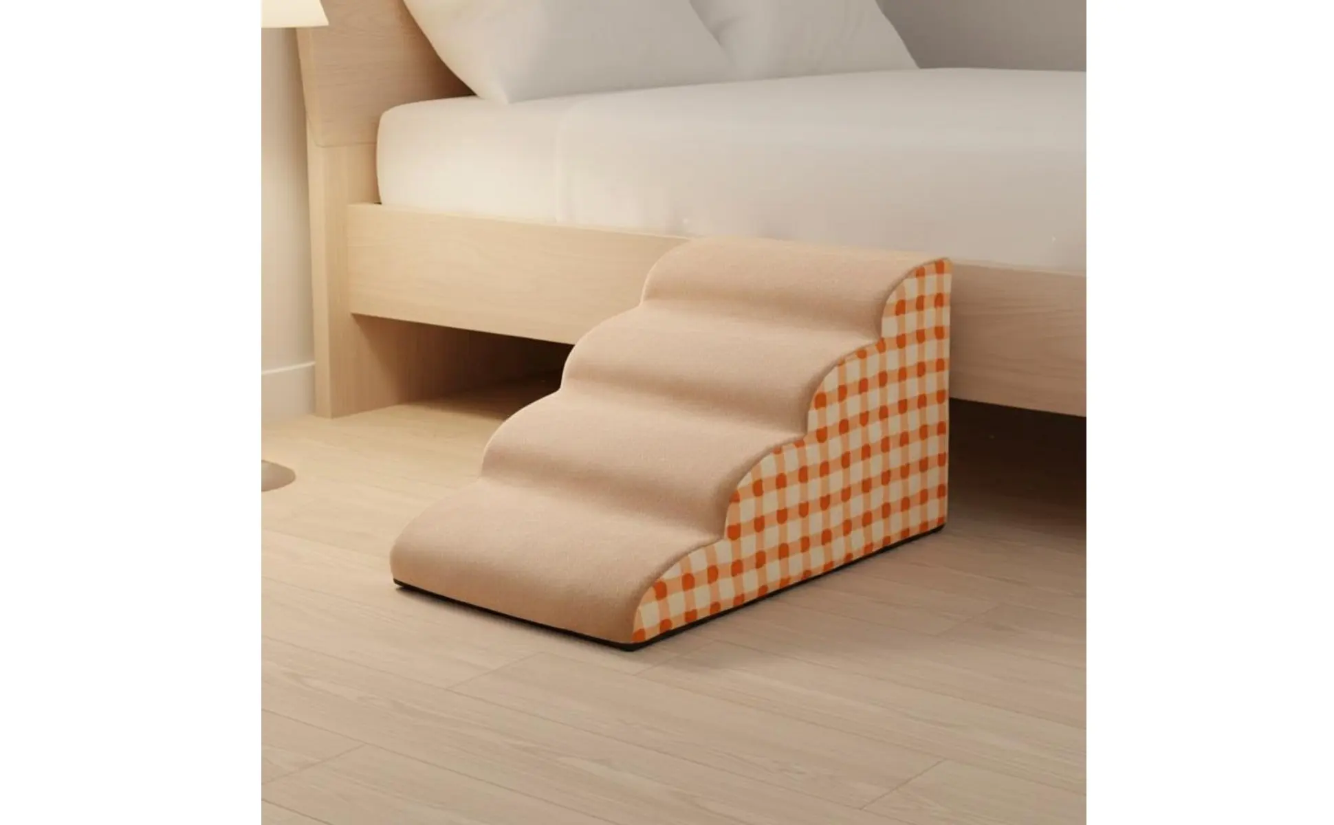 Escalones de espuma para perros junto a una cama