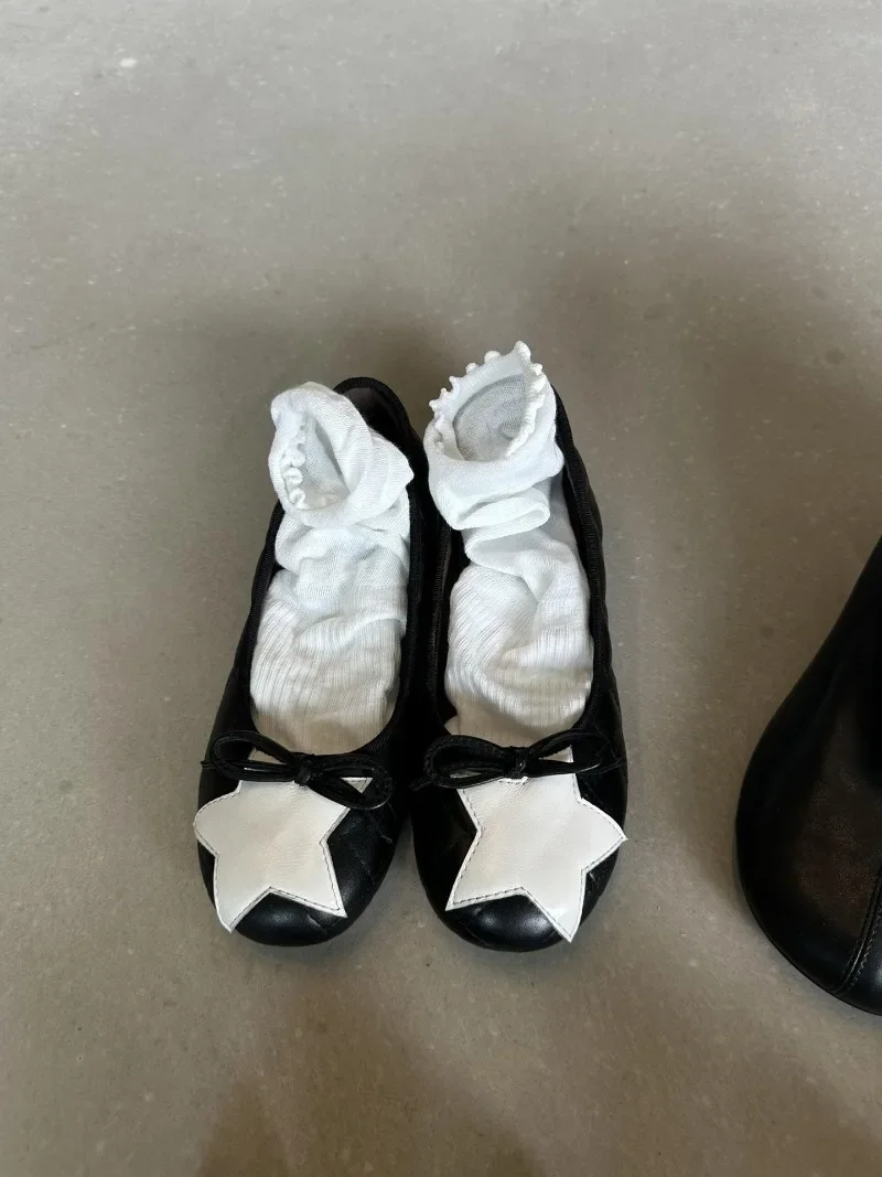 Detalle del lazo de estrella en bailarinas TULX