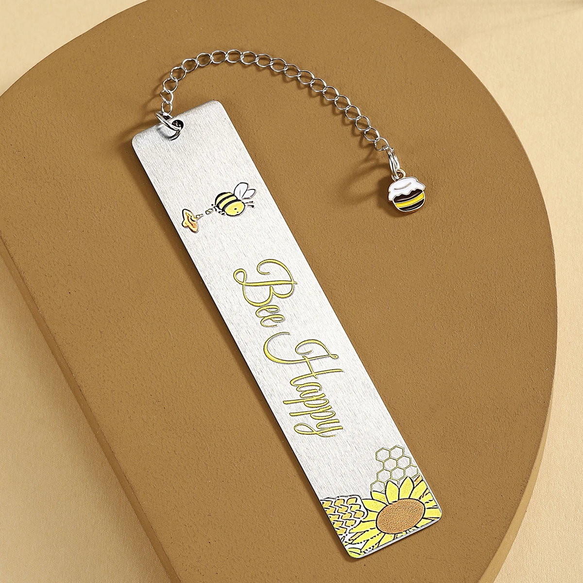 Marcapáginas de abeja en acero inoxidable con diseño detallado